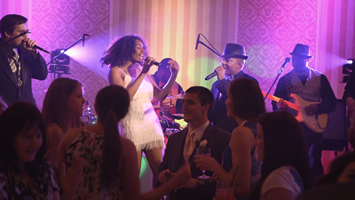 Affirmative Groove performs on stage at wedding