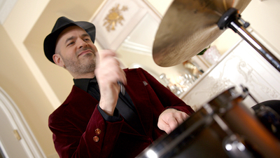 Alegria drummer performing live in a ballroom