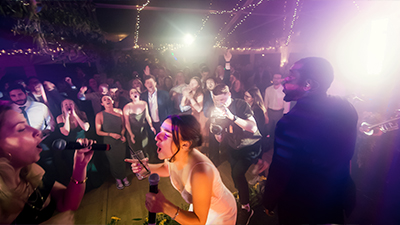 Synergy bride sings with band