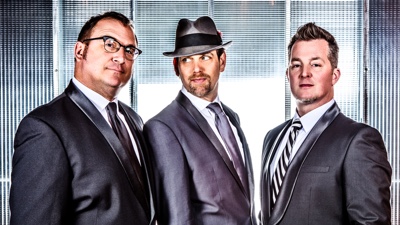 E3 promotional photo formal band members in suits