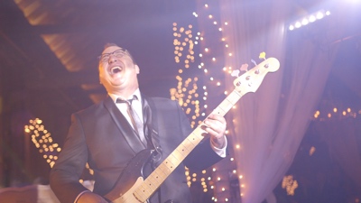 E3 drummer performing and singing for live concert