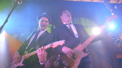 E3 guitar and bass player performing live for corporate event