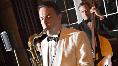 Jeff Decker Band sax and bass performance for live audience at a concert