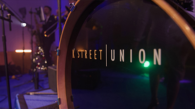 K Street Union logo on the drumset