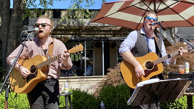 No Charge duo band members perform live outdoor concert