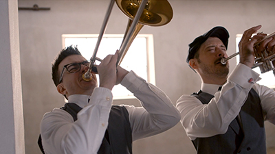 Revel Radio  horn players entertain at a corporate ballroom