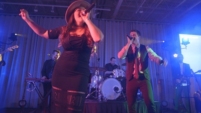 Free The male and female singers entertaining guests at corporate event